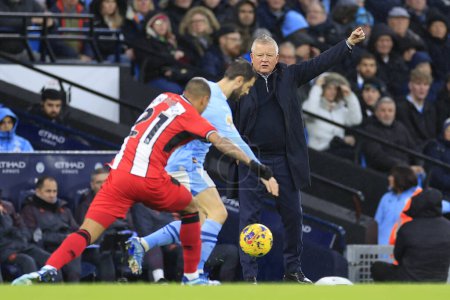 Photo for Chris Wilder the Sheffield United Manager tries to direct proceedings  during the Premier League match Manchester City vs Sheffield United at Etihad Stadium, Manchester, United Kingdom, 30th December 202 - Royalty Free Image