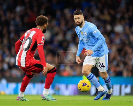 Photo for Joko Gvardiol of Manchester City breaks forward with the ball, during the Premier League match Manchester City vs Sheffield United at Etihad Stadium, Manchester, United Kingdom, 30th December 2023 - Royalty Free Image