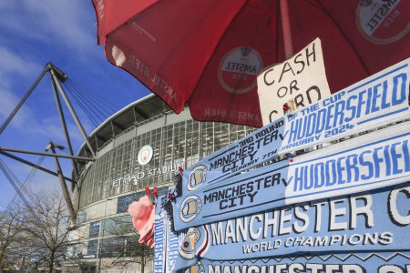 Photo for Matchday scarves for sale ahead of the Emirates FA Cup Third Round match Manchester City vs Huddersfield Town at Etihad Stadium, Manchester, United Kingdom, 7th January 202 - Royalty Free Image
