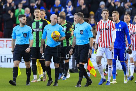 Photo for Referee Paul Tierney leads the team out for the start of the Emirates FA Cup Third Round match Stoke City vs Brighton and Hove Albion at Bet365 Stadium, Stoke-on-Trent, United Kingdom, 6th January 202 - Royalty Free Image
