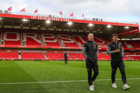 Photo for Andy Lyons of Blackpool and Kenny Dougall of Blackpool inspect the pitch ahead of the Emirates FA Cup Third Round match Nottingham Forest vs Blackpool at City Ground, Nottingham, United Kingdom, 7th January 202 - Royalty Free Image