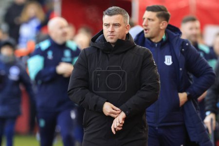 Photo for Steven Schumacher the Stoke City manager walks to the dug out for the start of the Emirates FA Cup Third Round match Stoke City vs Brighton and Hove Albion at Bet365 Stadium, Stoke-on-Trent, United Kingdom, 6th January 202 - Royalty Free Image