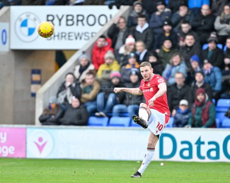 Photo for Paul Mullin of Wrexham crosses the ball towards the box, during the Emirates FA Cup Third Round match Shrewsbury Town vs Wrexham at Croud Meadow, Shrewsbury, United Kingdom, 7th January 202 - Royalty Free Image