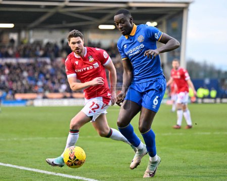 Photo for Jason Sraha of Shrewsbury Town and George Evans of Wrexham battle for the ball, during the Emirates FA Cup Third Round match Shrewsbury Town vs Wrexham at Croud Meadow, Shrewsbury, United Kingdom, 7th January 202 - Royalty Free Image
