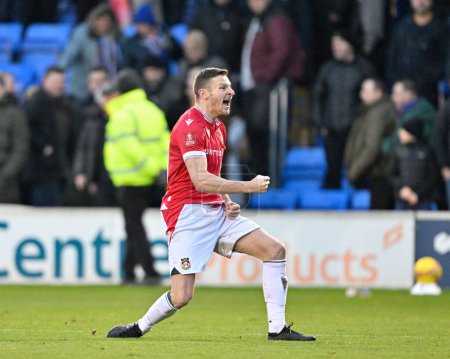 Photo for Paul Mullin of Wrexham celebrates the full time result, during the Emirates FA Cup Third Round match Shrewsbury Town vs Wrexham at Croud Meadow, Shrewsbury, United Kingdom, 7th January 202 - Royalty Free Image