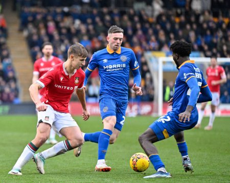 Photo for Max Cleworth of Wrexham gets tackled by Nohan Kenneh of Shrewsbury Town, during the Emirates FA Cup Third Round match Shrewsbury Town vs Wrexham at Croud Meadow, Shrewsbury, United Kingdom, 7th January 202 - Royalty Free Image