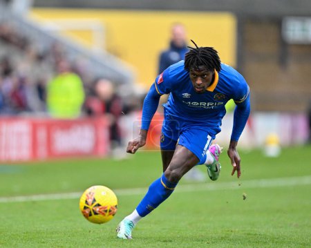 Photo for Tunmise Sobowale of Shrewsbury Town chases fown the ball, during the Emirates FA Cup Third Round match Shrewsbury Town vs Wrexham at Croud Meadow, Shrewsbury, United Kingdom, 7th January 202 - Royalty Free Image