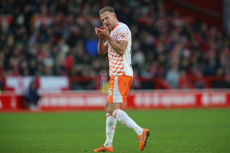 Photo for Jordan Rhodes of Blackpool applauds the travelling fans as he is substituted during the Emirates FA Cup Third Round match Nottingham Forest vs Blackpool at City Ground, Nottingham, United Kingdom, 7th January 202 - Royalty Free Image