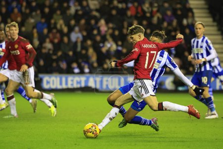 Photo for Alejandro Garnacho of Manchester United shoots on goal during the Emirates FA Cup Third Round match Wigan Athletic vs Manchester United at DW Stadium, Wigan, United Kingdom, 8th January 2024 - Royalty Free Image