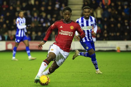 Photo for Kobbie Mainoo of Manchester United controls the ball during the Emirates FA Cup Third Round match Wigan Athletic vs Manchester United at DW Stadium, Wigan, United Kingdom, 8th January 2024 - Royalty Free Image