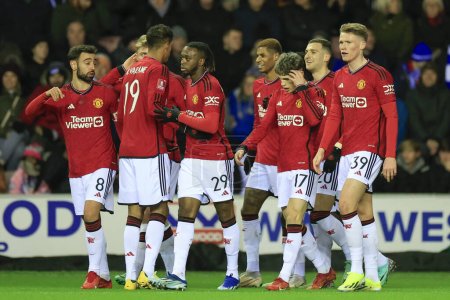 Photo for Manchester United players celebrate a goal by Diogo Dalot to make it 0-1 during the Emirates FA Cup Third Round match Wigan Athletic vs Manchester United at DW Stadium, Wigan, United Kingdom, 8th January 2024 - Royalty Free Image