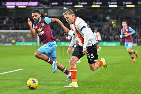 Photo for Alfie Doughty of Luton Town goes forward with the ball during the Premier League match Burnley vs Luton Town at Turf Moor, Burnley, United Kingdom, 12th January 2024 - Royalty Free Image