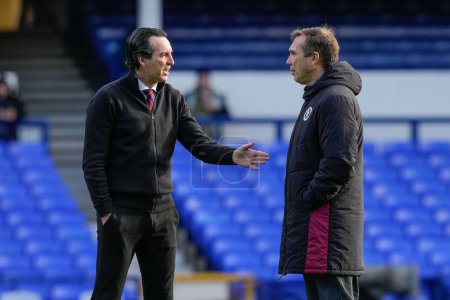 Photo for Unai Emery manager of Aston Villa speaks to Pablo Villanueva Assistant Manager during the Premier League match Everton vs Aston Villa at Goodison Park, Liverpool, United Kingdom, 14th January 2024 - Royalty Free Image
