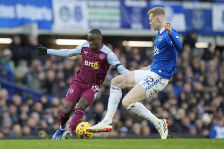 Photo for Moussa Diaby of Aston Villa under pressure from , Jarrad Branthwaite during the Premier League match Everton vs Aston Villa at Goodison Park, Liverpool, United Kingdom, 14th January 2024 - Royalty Free Image