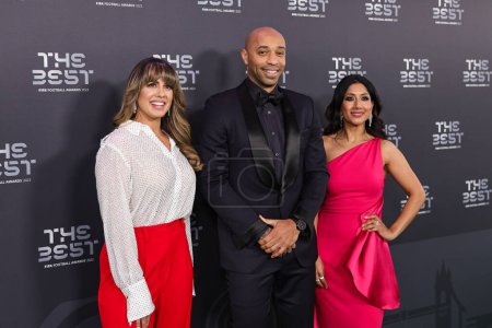 Photo for Thierry Henry, Duda Pavao and Reshmin Chowdhury and arrives on the Green Carpet ahead of The Best FIFA Football Awards 2023 at Apollo Theatre, London, United Kingdom, 15th January 2024 - Royalty Free Image