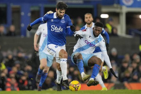 Photo for Jefferson Lerma of Crystal Palace lives the ground as he tackles Andr Gomes of Everton during the Emirates FA Cup Third Round Replay match Everton vs Crystal Palace at Goodison Park, Liverpool, United Kingdom, 17th January 2024 - Royalty Free Image