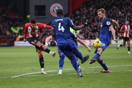 Photo for George Baldock of Sheffield United shoots on goal forcing the keeper to push it out for a corner during the Premier League match Sheffield United vs West Ham United at Bramall Lane, Sheffield, United Kingdom, 21st January 202 - Royalty Free Image