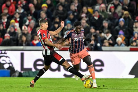 Photo for Orel Mangala of Nottingham Forest is tackled by Vitaly Janelt of Brentford during the Premier League match Brentford vs Nottingham Forest at The Gtech Community Stadium, London, United Kingdom, 20th January 202 - Royalty Free Image
