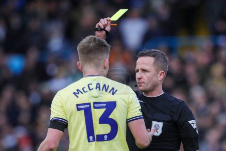 Photo for Referee David Webb awards a yellow card to Ali McCann during the Sky Bet Championship match Leeds United vs Preston North End at Elland Road, Leeds, United Kingdom, 21st January 202 - Royalty Free Image