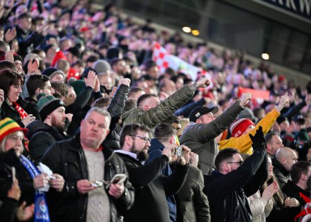 Photo for Wrexham fans in full voice ahead of kick off, during the Emirates FA Cup Fourth Round match Blackburn Rovers vs Wrexham at Ewood Park, Blackburn, United Kingdom, 29th January 202 - Royalty Free Image