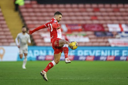 Photo for Adam Phillips of Barnsley controls the ball during the Sky Bet League 1 match Barnsley vs Exeter City at Oakwell, Barnsley, United Kingdom, 27th January 202 - Royalty Free Image