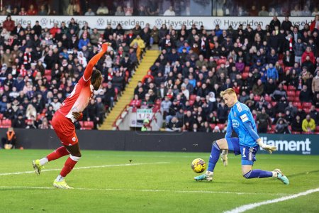 Photo for Viljami Sinisalo of Exeter City saves a shot from Devante Cole of Barnsley during the Sky Bet League 1 match Barnsley vs Exeter City at Oakwell, Barnsley, United Kingdom, 27th January 202 - Royalty Free Image
