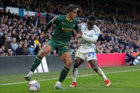 Photo for Ashley Phillips of Plymouth Argyle and Wilfried Gnonto of Leeds United battle for the ball during the Emirates FA Cup  Fourth Round match Leeds United vs Plymouth Argyle at Elland Road, Leeds, United Kingdom, 27th January 202 - Royalty Free Image