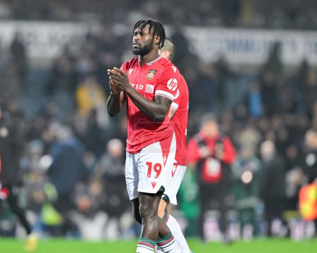 Photo for Jacob Mendy of Wrexham claps fans at full time,during the Emirates FA Cup Fourth Round match Blackburn Rovers vs Wrexham at Ewood Park, Blackburn, United Kingdom, 29th January 202 - Royalty Free Image