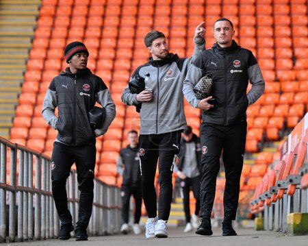 Photo for Karamoko Dembl of Blackpool, James Husband of Blackpool and Oliver Norburn of Blackpool arrives ahead of the match, during the Bristol Street Motors Trophy Quarter Final match Blackpool vs Bolton Wanderers at Bloomfield Road, Blackpool, UK - Royalty Free Image