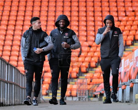 Photo for Jordan Lawrence-Gabriel of Blackpool, Kylian Kouassi of Blackpool and Tashan Oakley-Boothe of Blackpool arrive ahead of the match, during the Bristol Street Motors Trophy Quarter Final match Blackpool vs Bolton Wanderers at Bloomfield Road, Blackpool - Royalty Free Image