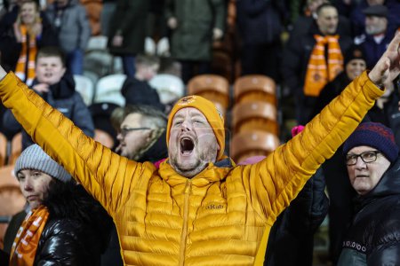 Photo for Blackpool fans celebrate the win on penalties during the Bristol Street Motors Trophy Quarter Final match Blackpool vs Bolton Wanderers at Bloomfield Road, Blackpool, United Kingdom, 30th January 202 - Royalty Free Image