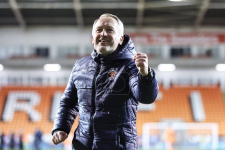 Photo for Neil Critchley head coach of Blackpool celebrates the win with the fans during the Bristol Street Motors Trophy Quarter Final match Blackpool vs Bolton Wanderers at Bloomfield Road, Blackpool, United Kingdom, 30th January 202 - Royalty Free Image