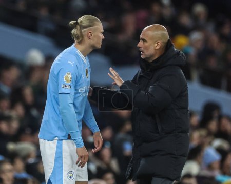 Photo for Pep Guardiola manager of Manchester City talks to Erling Hland of Manchester City during the Premier League match Manchester City vs Burnley at Etihad Stadium, Manchester, United Kingdom, 31st January 2024 - Royalty Free Image