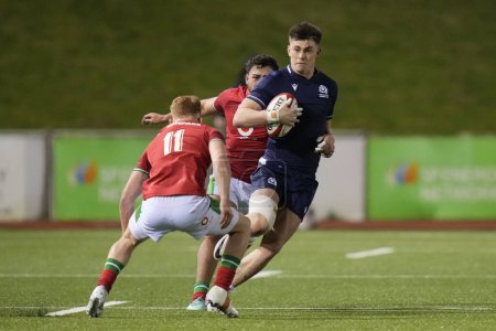 Photo for Kerr Johnston of Scotland U20's riuns at Walker Price of Wales U20's during the 2024 Guinness U20 Six Nations match Wales U20s vs Scotland U20s at Stadiwm CSM, Colwyn Bay, United Kingdom, 2nd February 202 - Royalty Free Image