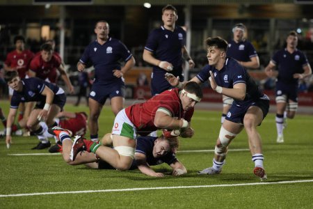Photo for Morgan Morse of Wales U20's breaks through the Scotland U20's defence to score a try during the 2024 Guinness U20 Six Nations match Wales U20s vs Scotland U20s at Stadiwm CSM, Colwyn Bay, United Kingdom, 2nd February 202 - Royalty Free Image