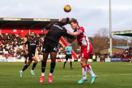 Photo for Kylian Kouassi of Blackpool and Carl Piergianni of Stevenage battle for the ball during the Sky Bet League 1 match Stevenage vs Blackpool at Lamex Stadium, Stevenage, United Kingdom, 3rd February 202 - Royalty Free Image