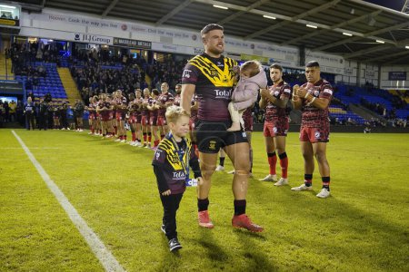 Photo for Joe Philbin of Warrington Wolves walks out with his children through a guard of honour before the Rugby League Joe Philbin Testimonial match Warrington Wolves vs Leigh Leopards at Halliwell Jones Stadium, Warrington, United Kingdom, 3rd February 202 - Royalty Free Image