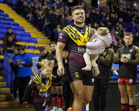 Photo for Joe Philbin of Warrington Wolves walks out with his children before the Rugby League Joe Philbin Testimonial match Warrington Wolves vs Leigh Leopards at Halliwell Jones Stadium, Warrington, United Kingdom, 3rd February 202 - Royalty Free Image
