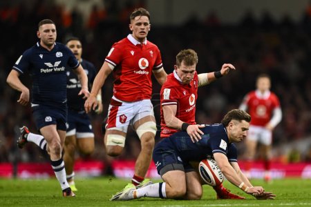 Photo for Kyle Rowe of Scotland under pressure from Nick Tompkins of Wales during the 2024 Guinness 6 Nations match Wales vs Scotland at Principality Stadium, Cardiff, United Kingdom, 3rd February 202 - Royalty Free Image