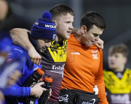 Photo for Luke Thomas of Warrington Wolves is helped from the pitch by medics during the Rugby League Joe Philbin Testimonial match Warrington Wolves vs Leigh Leopards at Halliwell Jones Stadium, Warrington, United Kingdom, 3rd February 202 - Royalty Free Image