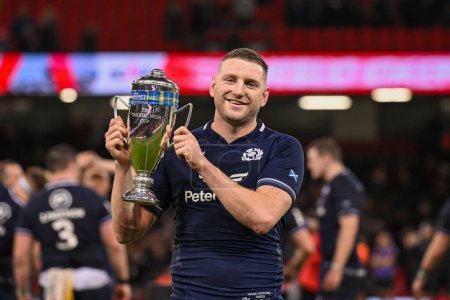Photo for Finn Russell of Scotland  lift the Doddie Weir Cup after beating Wales in the 2024 Guinness 6 Nations match Wales vs Scotland at Principality Stadium, Cardiff, United Kingdom, 3rd February 202 - Royalty Free Image