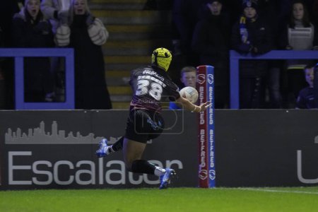 Photo for Frank Sergent of Warrington Wolves juggles the ball before scoring a try during the Rugby League Joe Philbin Testimonial match Warrington Wolves vs Leigh Leopards at Halliwell Jones Stadium, Warrington, United Kingdom, 3rd February 202 - Royalty Free Image