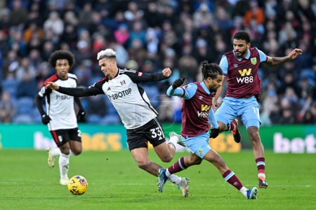 Photo for Lorenz Assignon of Burnley fouls Antonee Robinson of Fulham, during the Premier League match Burnley vs Fulham at Turf Moor, Burnley, United Kingdom, 3rd February 202 - Royalty Free Image