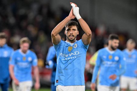Photo for Rben Dias of Manchester City applauds the travelling fans after Manchester City win 1-3 during the Premier League match Brentford vs Manchester City at The Gtech Community Stadium, London, United Kingdom, 5th February 2024 - Royalty Free Image
