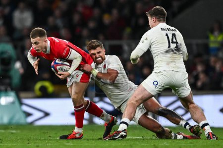 Photo for Cameron Winnett of Wales is tackled by Henry Slade of England during the 2024 Guinness 6 Nations match England vs Wales at Twickenham Stadium, Twickenham, United Kingdom, 10th February 202 - Royalty Free Image