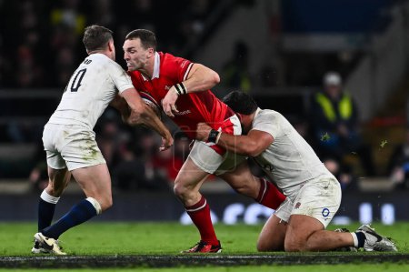 Photo for George North of Wales is tackled by Ellis Genge of England  and George Ford of England during the 2024 Guinness 6 Nations match England vs Wales at Twickenham Stadium, Twickenham, United Kingdom, 10th February 202 - Royalty Free Image