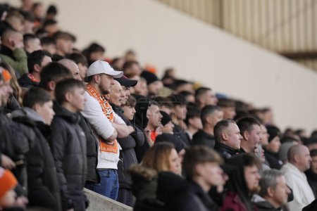 Photo for Blackpool fans watch the game during the Sky Bet League 1 match Blackpool vs Oxford United at Bloomfield Road, Blackpool, United Kingdom, 10th February 202 - Royalty Free Image