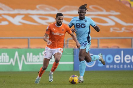 Photo for CJ Hamilton of Blackpool cuts inside Greg Leigh of Oxford United during the Sky Bet League 1 match Blackpool vs Oxford United at Bloomfield Road, Blackpool, United Kingdom, 10th February 202 - Royalty Free Image