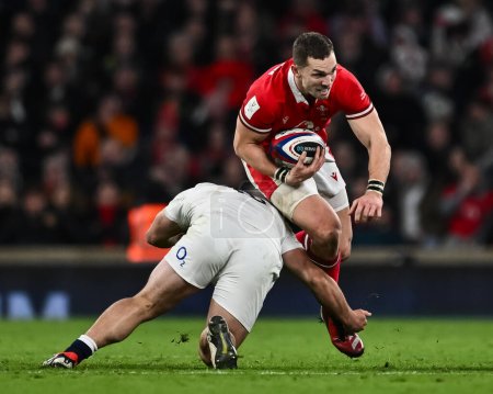 Photo for George North of Wales evades the tackle of Theo Dan of England during the 2024 Guinness 6 Nations match England vs Wales at Twickenham Stadium, Twickenham, United Kingdom, 10th February 202 - Royalty Free Image