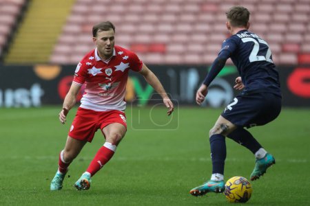 Photo for Herbie Kane of Barnsley and Ethan Galbraith of Leyton Orient battle for the ball during the Sky Bet League 1 match Barnsley vs Leyton Orient at Oakwell, Barnsley, United Kingdom, 10th February 202 - Royalty Free Image
